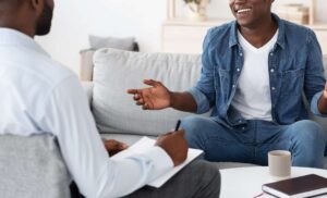 man at therapy counselling smiling